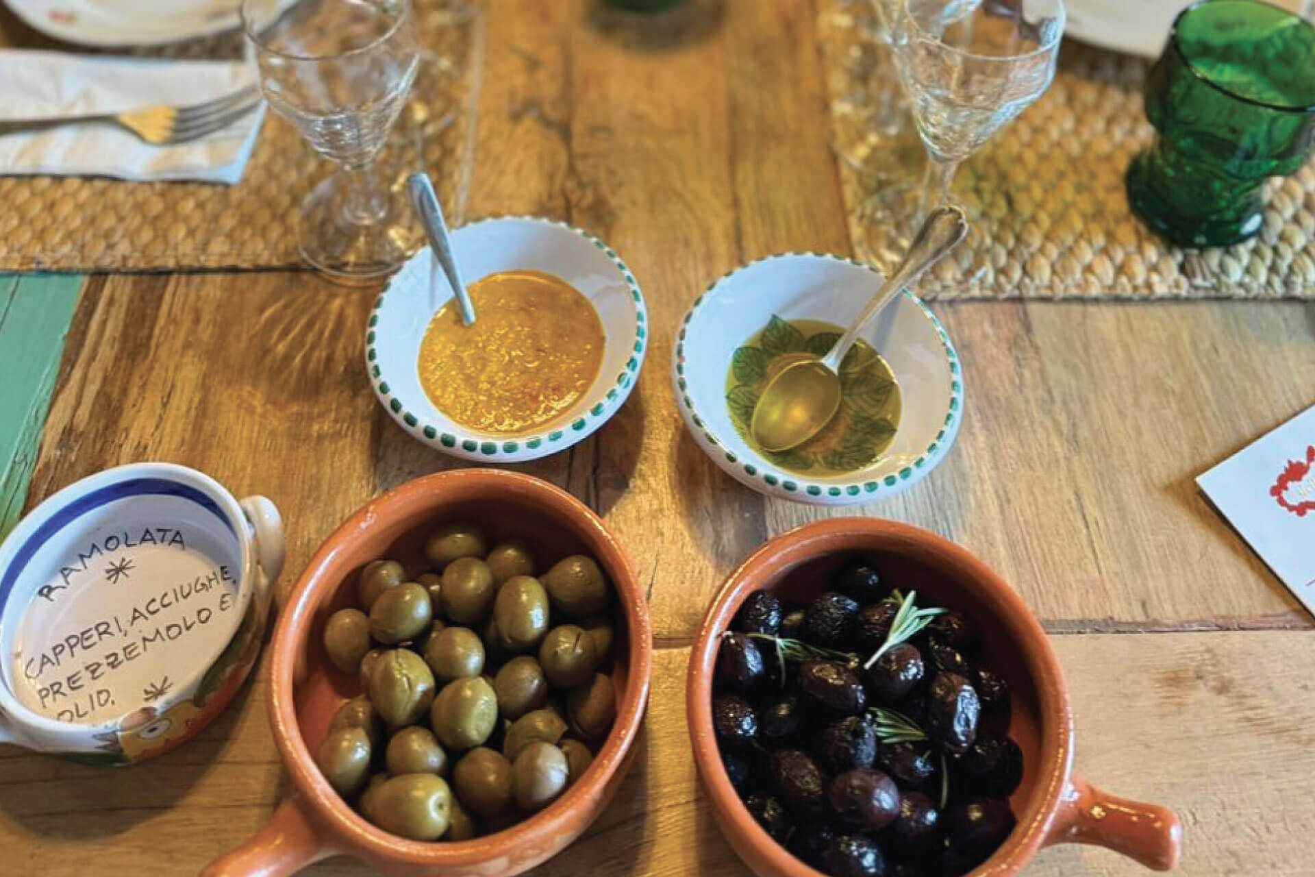 Selection of Sicilian olives and cheeses served during the Nebrodi Mountains wine tasting experience